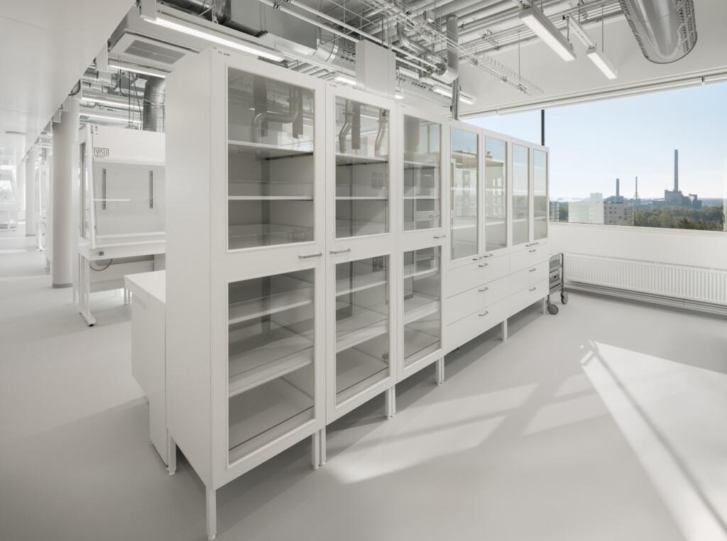 Storage solutions in the EriCa Green Park laboratory. In the background, a window opens to a city view.